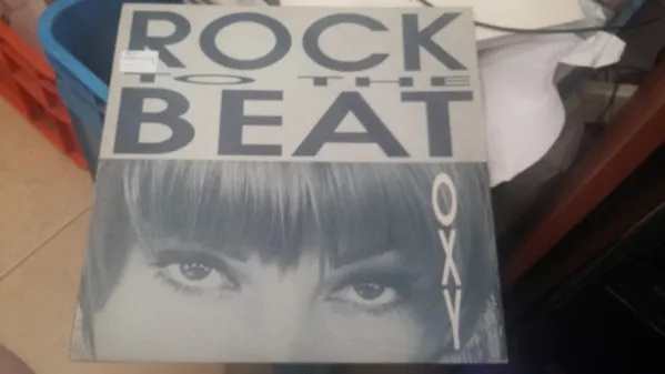 OXY — Rock To The Beat, cover art